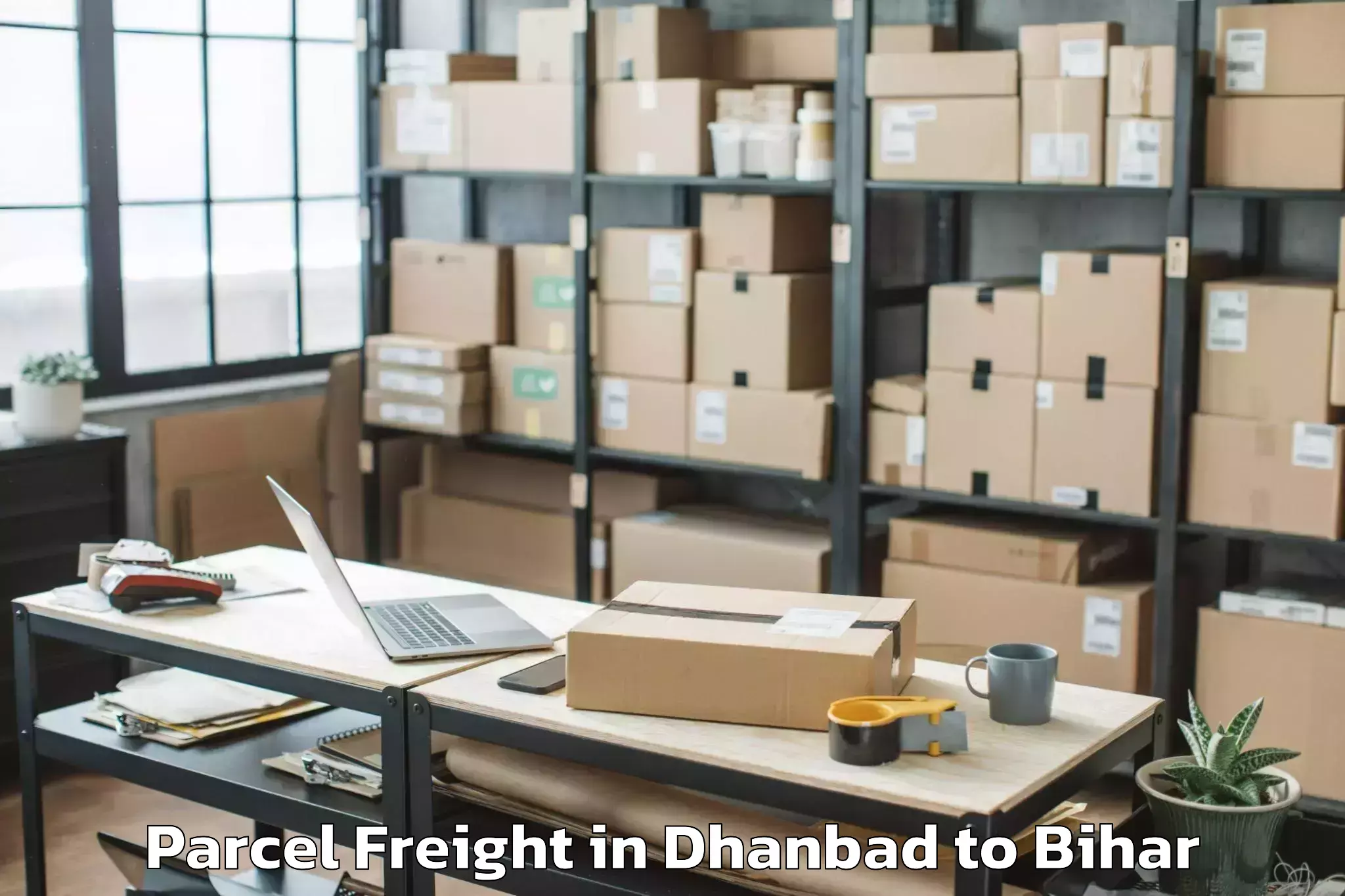 Easy Dhanbad to Wazirganj Parcel Freight Booking